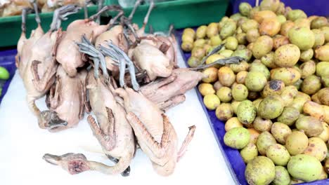 assorted vegetables and fruits displayed on a rotating market stall