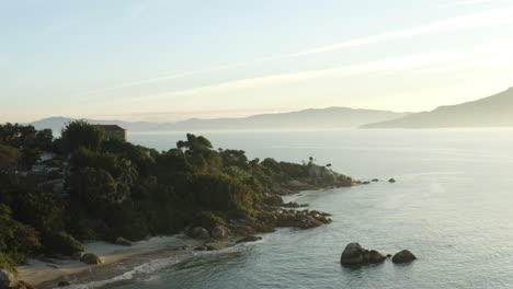 aerial drone view distancing of heavenly brazilian beach sunset, jurere internacional, florianopolis, santa catarina, brazil