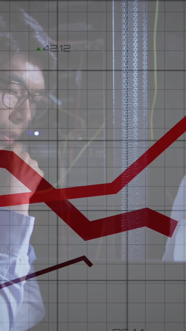 Animation of red lines over diverse male and female it engineers with laptop by computer server