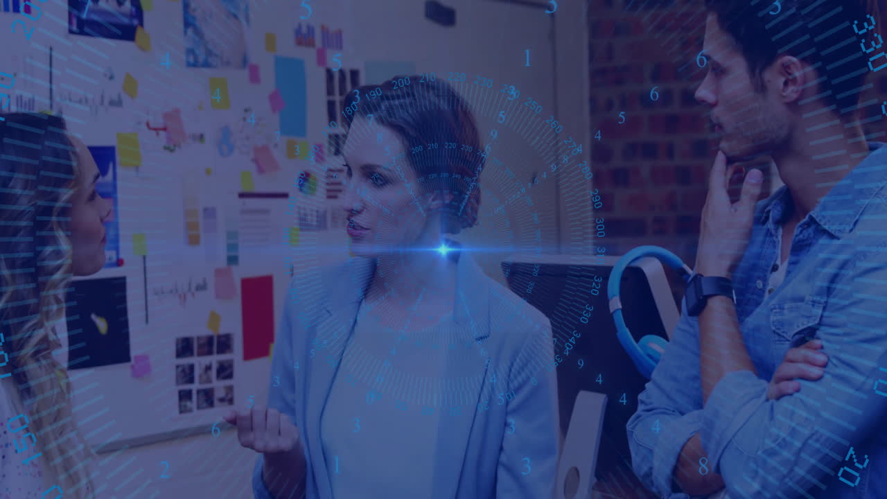 Diverse team discussing in office with digital data overlay animation