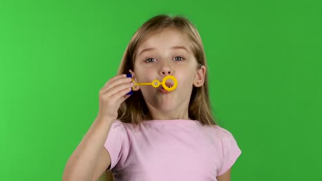 baby lets the soap bubbles green screen baby girl lets multicolored soap bubbles and sincere smiles green screen