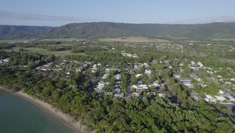 villas and apartments on green coastline of port douglas in queensland, australia