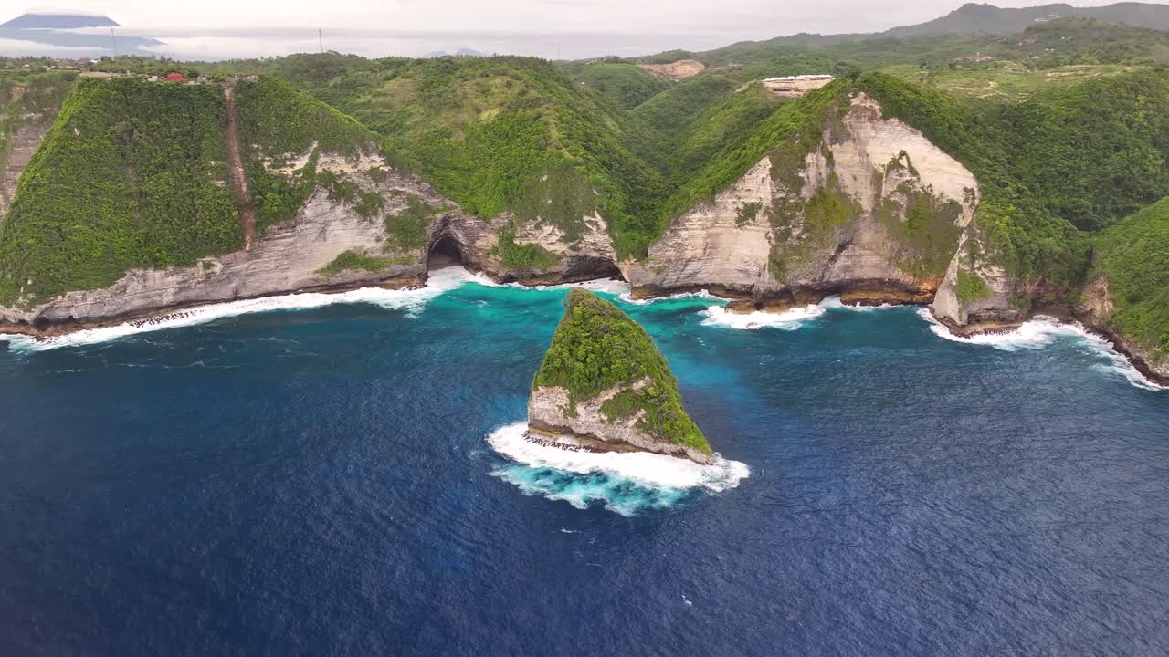 Dramatic coastal scenery of Nusa Penida, Bali. Limestone cliffs and rock formation. Drone panorama.