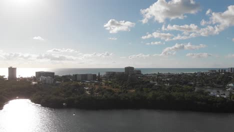 aerial view of coastal city with ocean and buildings