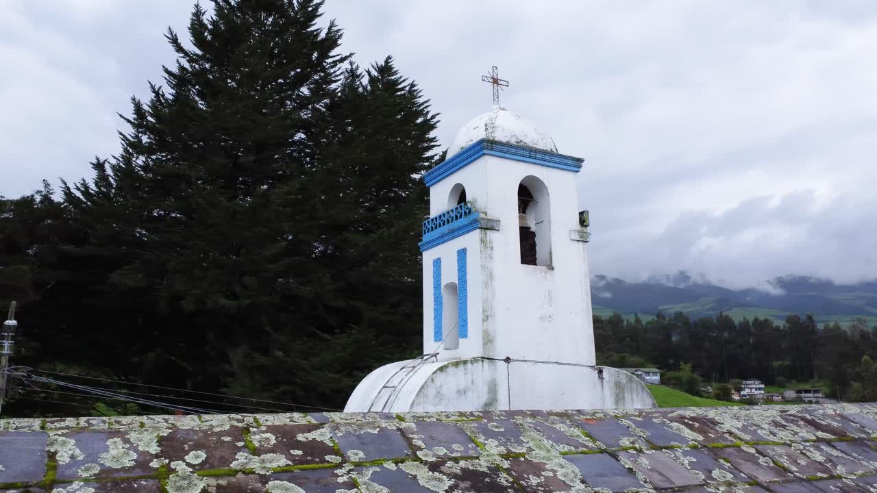 drone panning of the bell tower of the church of Barrio G&uuml;itig, Machachi, Ecuador