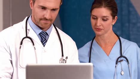 Doctor-and-nurse-looking-a-laptop