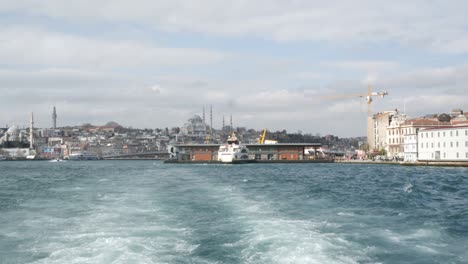 hagia sophia cathedral in modern istanbul city, turkey view from sailing ship. modern landscape istanbul and trail water from sailing boat.