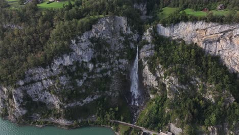 waterfall flowing into walensee near betlis, wessen, amden, kanton st. gallen, switzerland, with steep cliffs