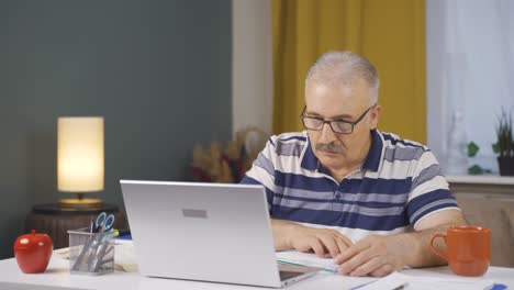 Home office worker old man thinking worriedly.