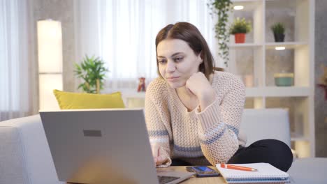 Young-Woman-Using-Laptop-Uses-Credit-Debit-Card-for-Online-Shopping-Purchases.