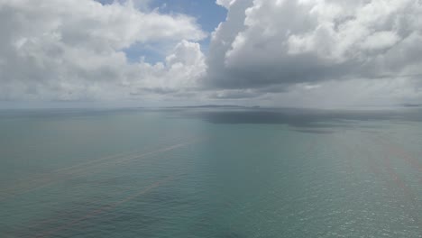 calm blue ocean on overcast day near yeppoon in shire of livingstone, queensland, australia