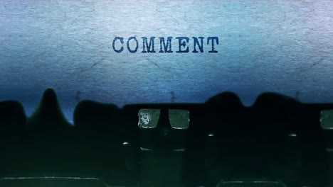 comment word closeup being typing and centered on a sheet of paper on old vintage typewriter
