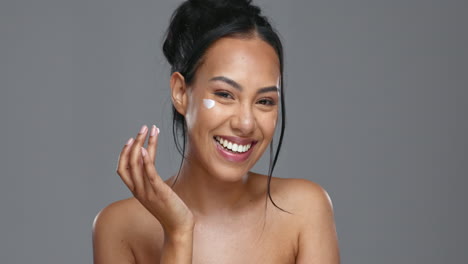 Face,-skincare-and-happy-woman-with-cream