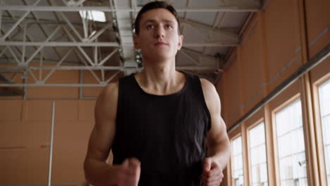 young man running indoors