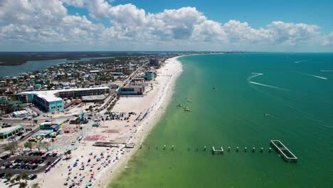 high elevation drone shot over fort myers beach during the busy season