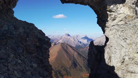 hiker standing on arch mountains tilt kananaskis alberta canada