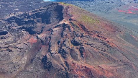 Drone-view,-ascending-from-bottom-to-top-movement-on-Piton-Chisny-in-the-Plaine-des-Sables-volcanic-plain,-Réunion-Island