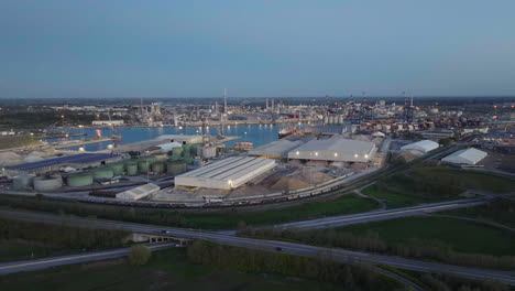 Aerial-view-of-the-industrial-and-port-area-of-Ravenna-,chemical-and-petrochemical-pole,thermoelectric,metallurgical-plants-and-hydrocarbon-refinery-and-liquefied-natural-gas-tanks-shot-at-24-fps