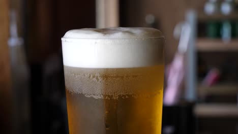 close-up of a frothy glass of beer