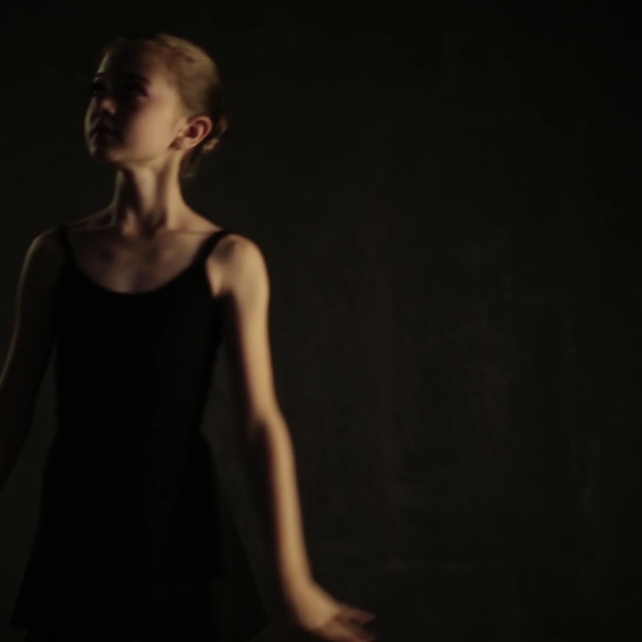 Ballerina Dancing In Studio