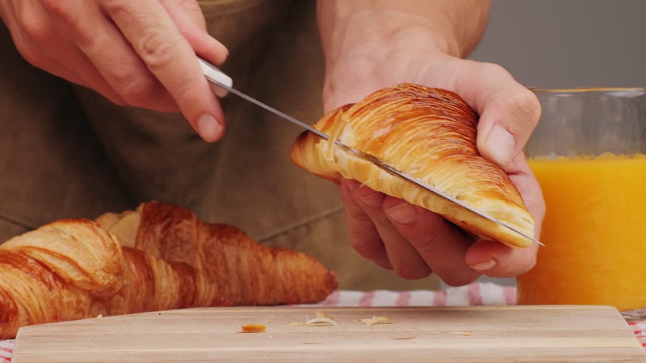 Croissant with jamon ham, Salmon, in Modern Cafe, Top View of Healthy Breakfast in Cafe. English breakfast: fried egg, bacon toast on sandwich.