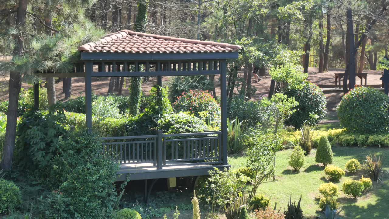 A scenic gazebo in a verdant garden
