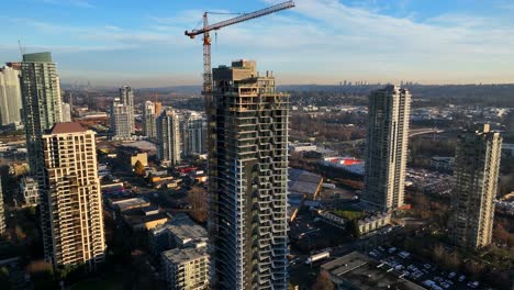 tower crane at the construction site of a residential tower in burnaby, british columbia, canada