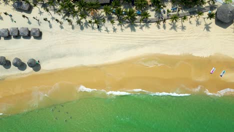 incredible top down flight over tropical beach resort with sand beach