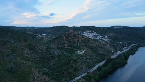 aerial view of a beautiful castle on the top of a mountain nearby tejo river in belver, portugal