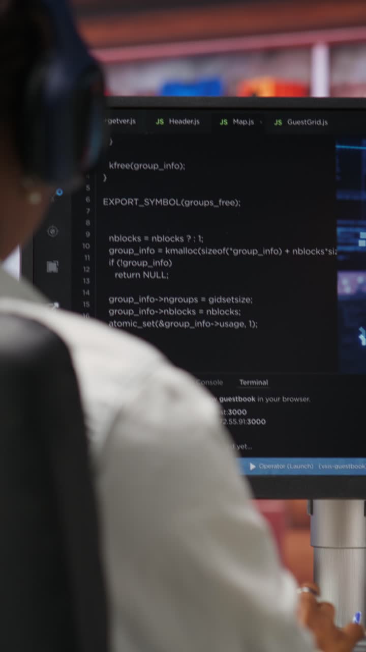 Vertical video IT engineer drinking coffee, using computer at home for AI computing