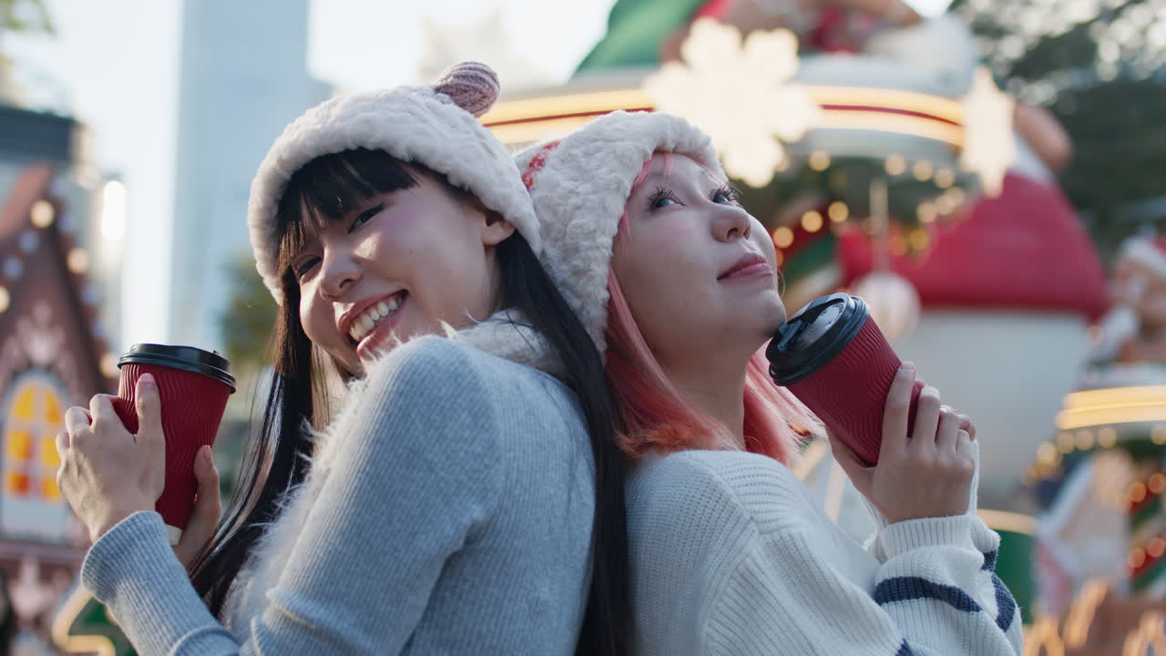 Two friends enjoying Christmas coffee