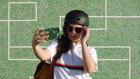 a cool female skater taking a selfie using