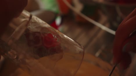 Close-up-carrying-a-glass-with-flour-where-it-is-finally-poured-into-a-container-with-a-dough-for-cooking