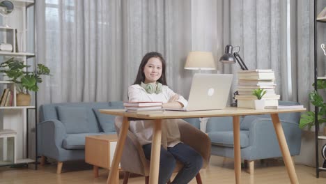 teenage girl studying online at home