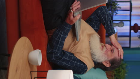 sad senior old grandfather man use laptop surprised by bad news, fortune loss, fail, lottery results