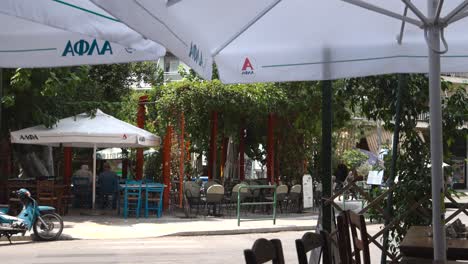 outdoor dining area with passing motorbike