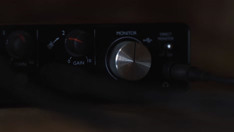 adjusting audio levels on an audio interface and guitar amplifier