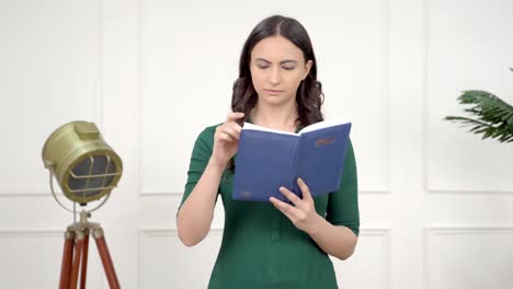 indian girl reading a book