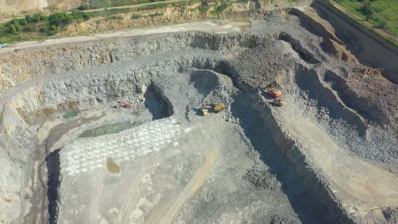 Granite quarry. Extraction of granite. Open cast mine. Mining industry. Stone Quarrying - Aerial view
