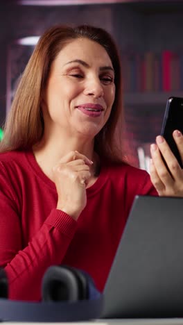 vertical video woman freelancer taking online course to develop new skills from home office
