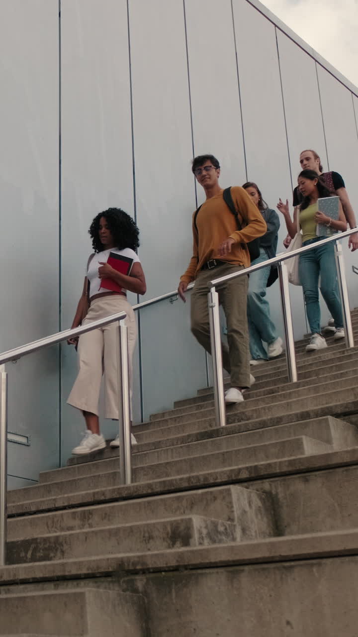 Students walking around the city, going down the stairs