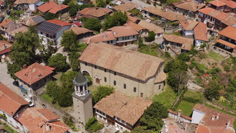 church bell tower among red terracotta rooftops of veliko tarnovo