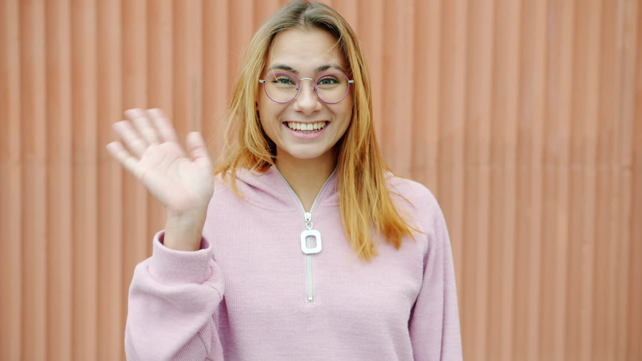 Woman Wearing Glasses and a Pink Hoodie