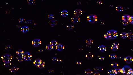 blue and orange soap bubbles on black background a lot of blue and orange soap bubbles isolated on black background