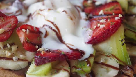 waffle with strawberries, kiwi, banana, and ice cream