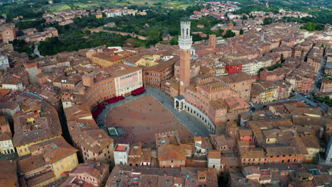 left to right panning aerial shot of the piazza del campo, siena, tuscany, italy.