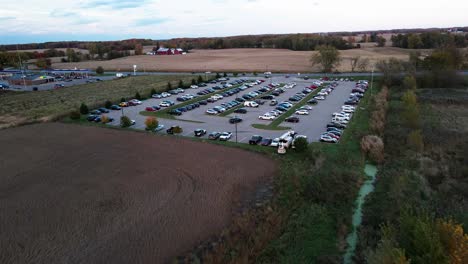 cars parked in a carpool lot between lansing and grand rapids