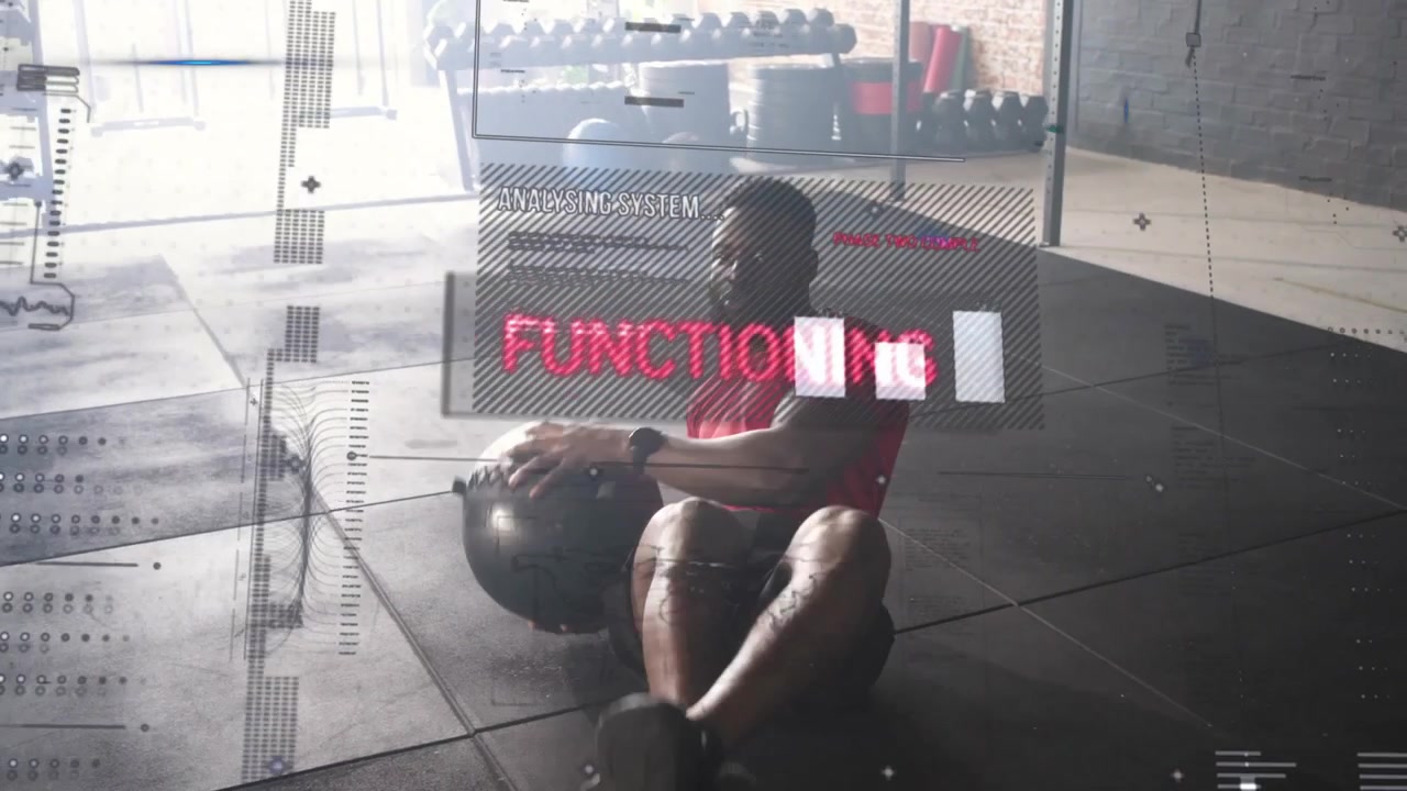 Man holding medicine ball, leaning back and rotating torso in gym while HUD tracking core metrics
