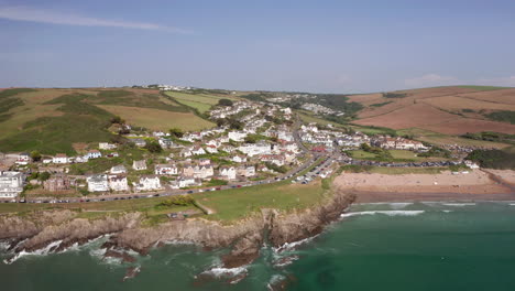 aerial truck revealing a seaside town on a perfect summer’s day