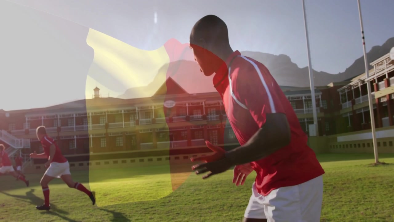 Drill starting, player running across sports pitch, flag overlay drifting, camera tracking closer